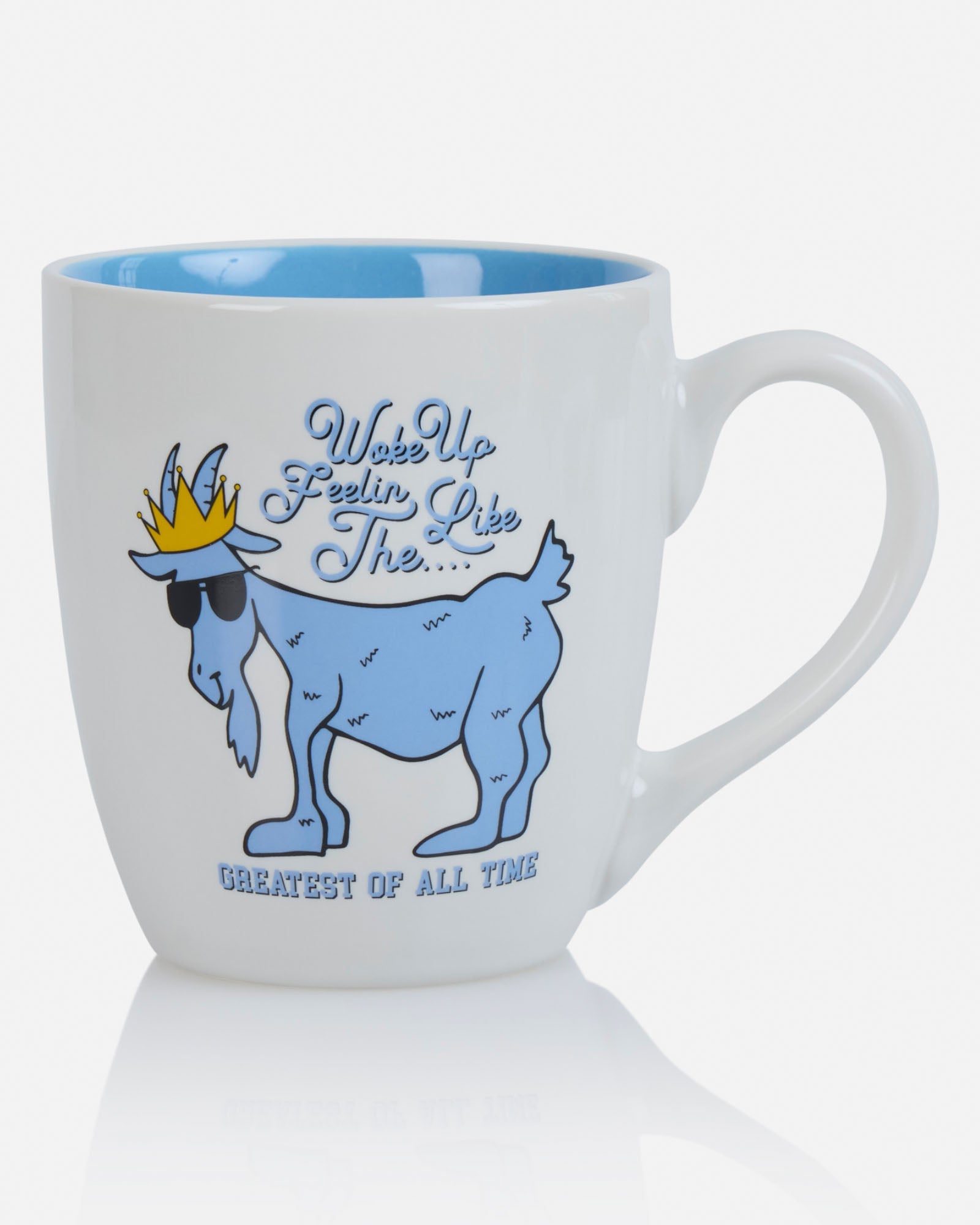 White mug with blue interior, goat graphic, and text on a white background