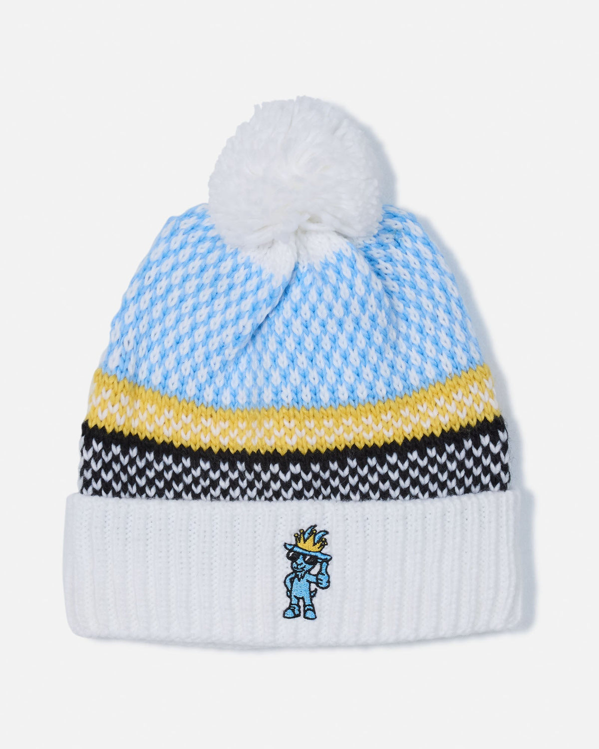 A light blue and white patterned knit beanie with a white pom-pom, a yellow stripe, a black and white chevron stripe, and a white ribbed cuff featuring a small embroidered blue character.
