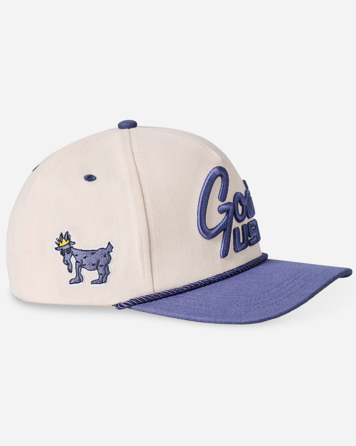 Angled view of navy "GOAT USA" snapback hat with Chuck the GOAT patch