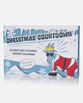 Goat USA Christmas Countdown advent calendar box featuring a cartoon blue goat dressed as Santa Claus on a white and blue illustrated background.