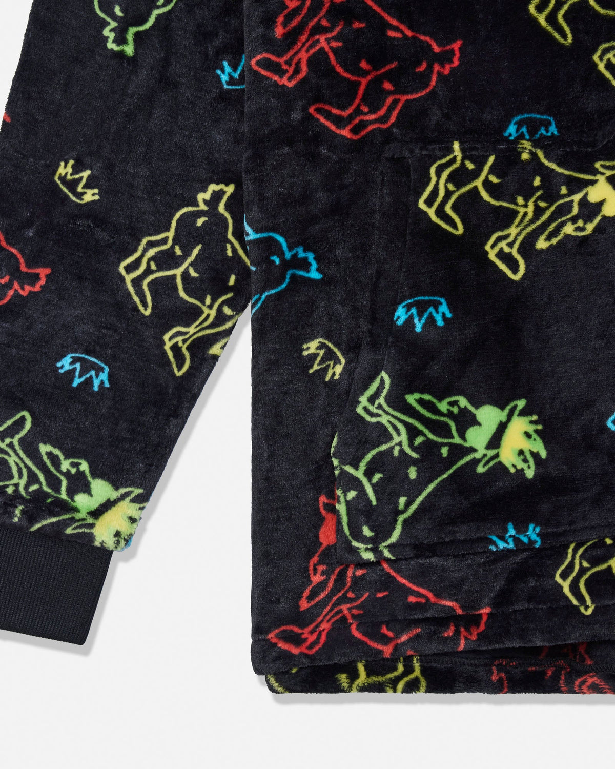 Close-up of a black plush pajama or fleece garment with an allover neon outline print of cartoon animals in red, yellow, green, blue, and orange, shown on a white background.
