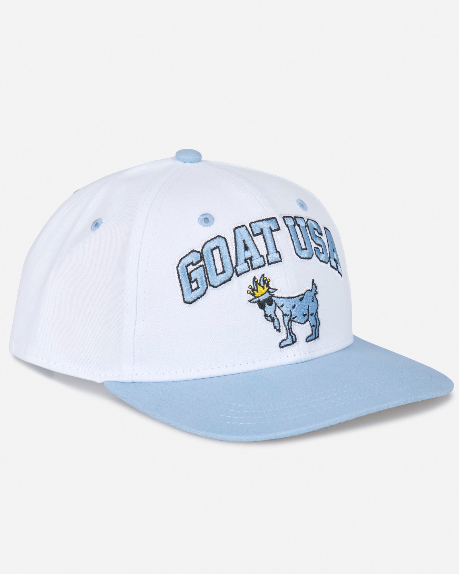 Angled view of white flat brim with "GOAT USA" text and Chuck the GOAT logo