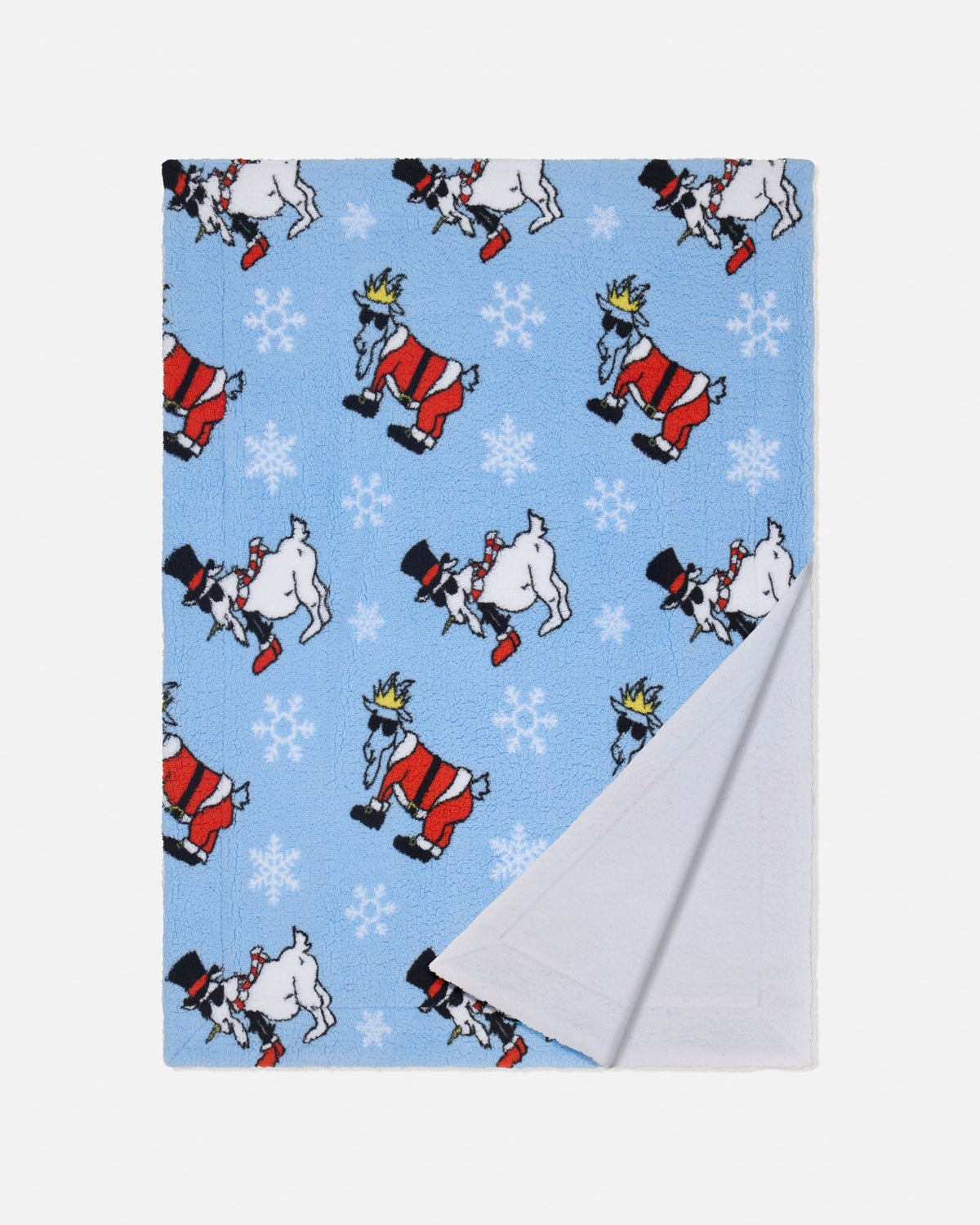 A folded blanket with a light blue front featuring a repeating pattern of goat santa and snowmen with snowflakes, and a white reverse side, shown on a light gray background.