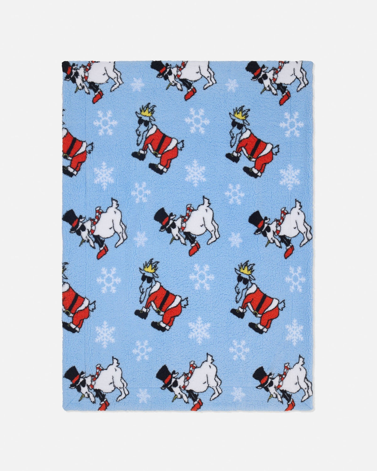 A rectangular fabric item, likely a blanket or towel, featuring a light blue background with a repeating pattern of cartoon goat santa & snowmen figures and white snowflakes.