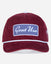 A burgundy corduroy baseball cap with a white embroidered 'Goat USA' patch on the front, a white stripe across the brim, and a small embroidered logo on the side, shown against a light gray background.