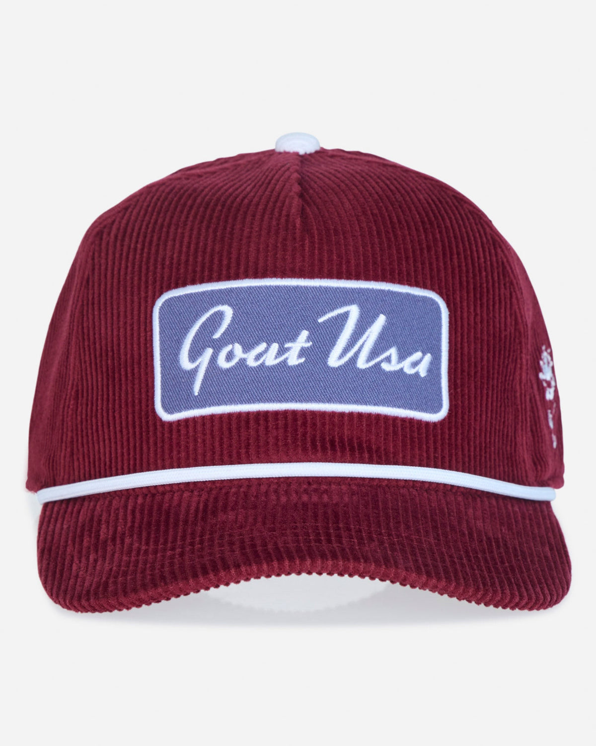 A burgundy corduroy baseball cap with a white embroidered 'Goat USA' patch on the front, a white stripe across the brim, and a small embroidered logo on the side, shown against a light gray background.