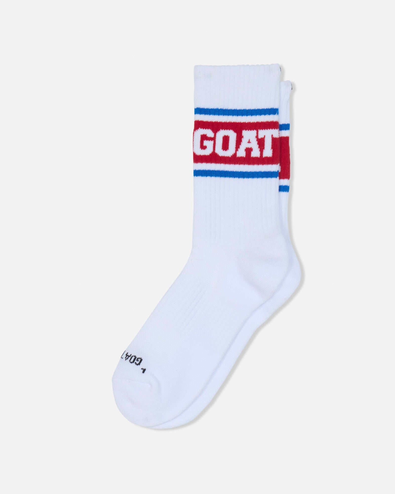 A single white crew sock with a red and blue stripe design and the word 'GOAT' in white on the cuff, shown on a light gray background.#color_true-red