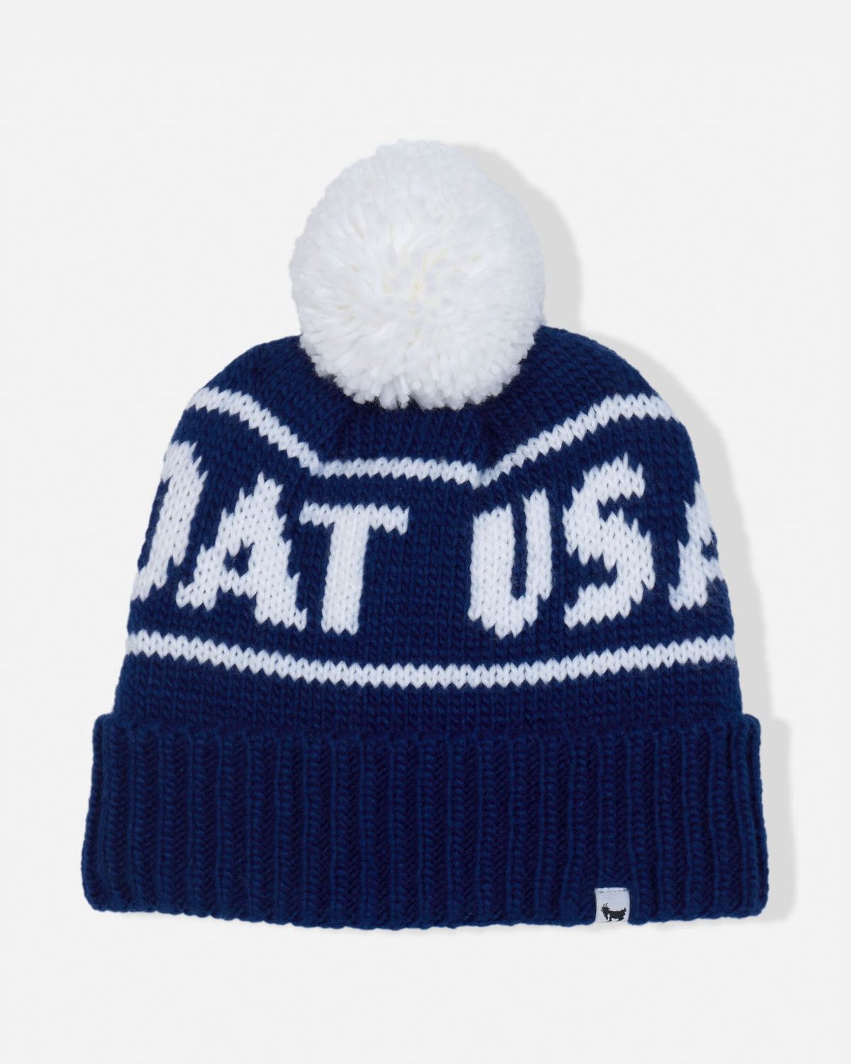A navy blue knit beanie with a white pom-pom on top. The beanie features white knit lettering that reads 'GOAT USA' across the front, with a ribbed cuff at the bottom.
