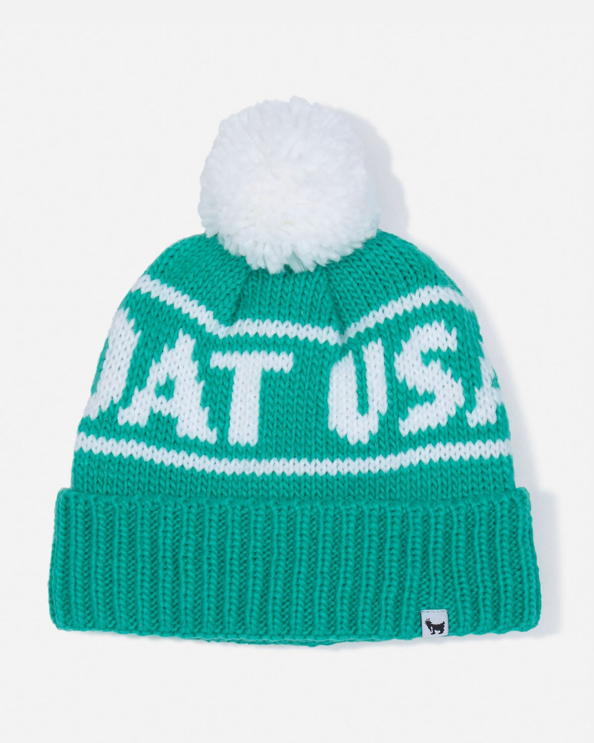 A green and white knit beanie hat with a white pom-pom on top. The front of the hat features the text 'GOAT USA' in white lettering, and there is a small black goat logo on the ribbed cuff.