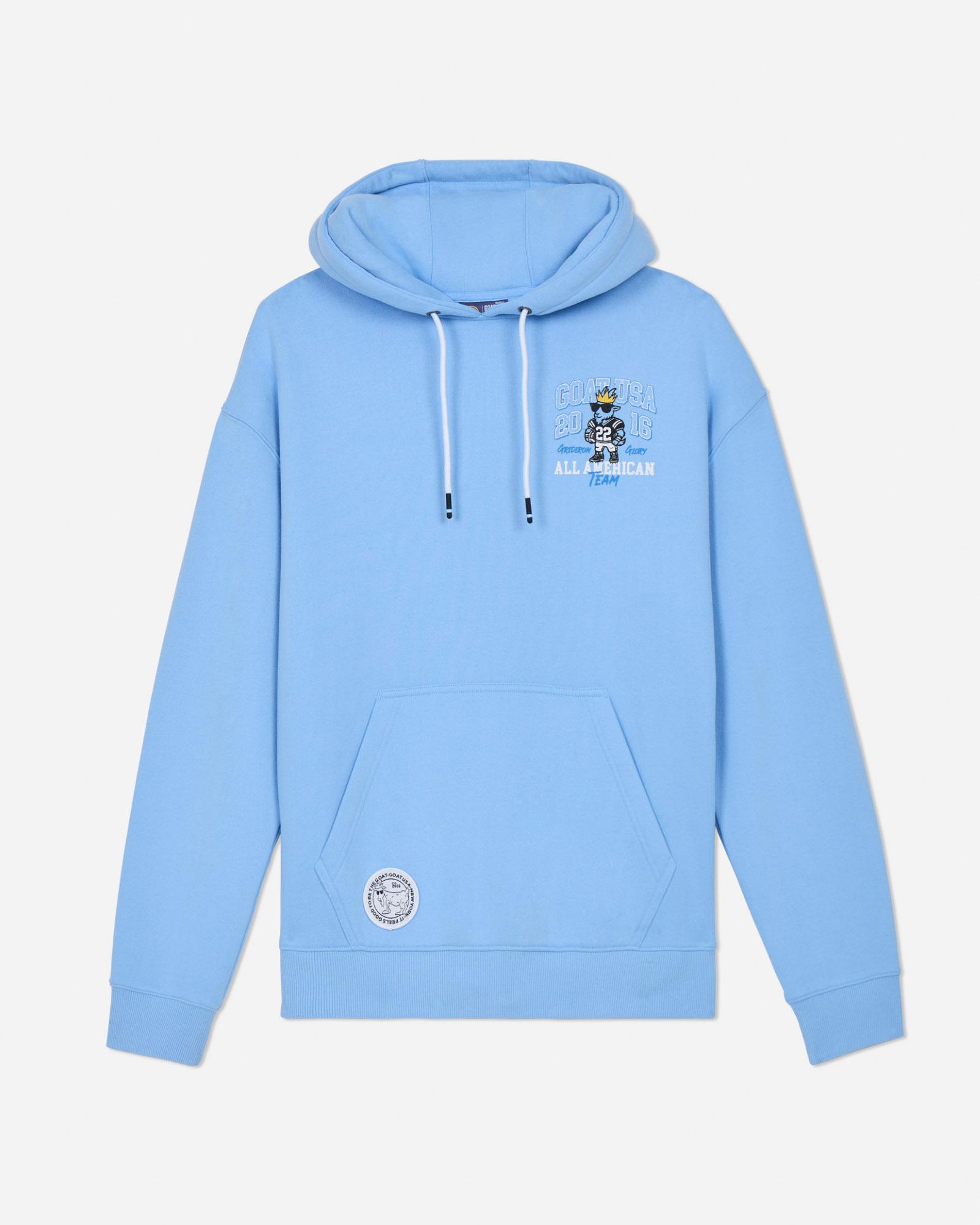 Light blue hoodie with a small logo on the chest against a light gray background