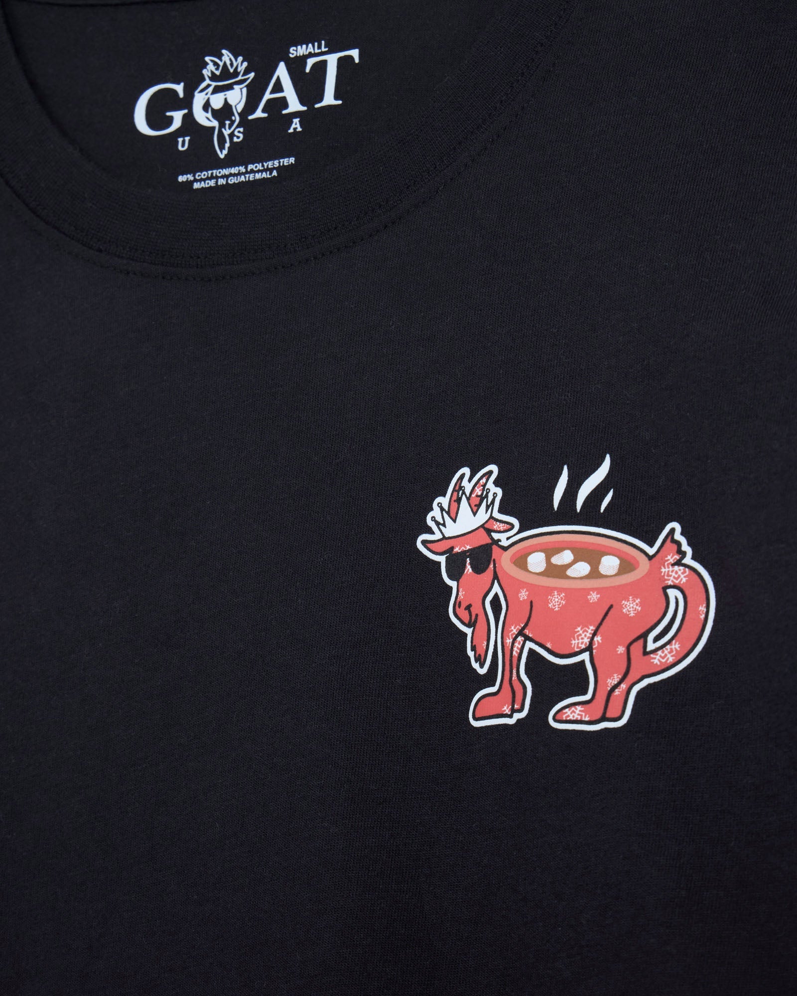 Black t-shirt with a red and white graphic of a goat hot cocoa and the brand 'GOAT USA' on a black background.