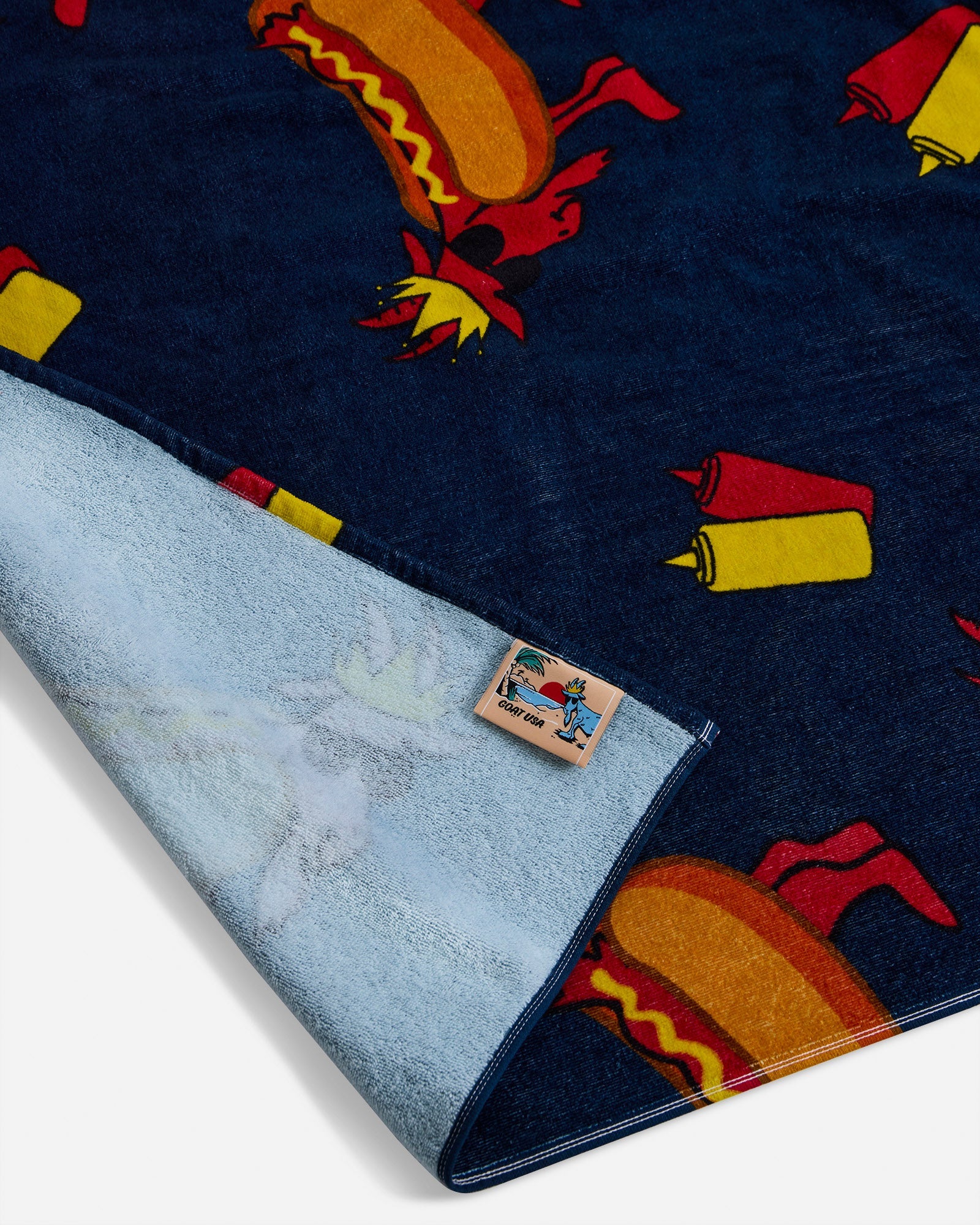 Close-up of navy hot dog GOAT towel