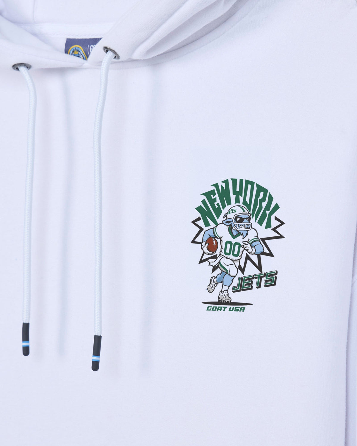 White pullover hoodie with a cartoon football player graphic on the chest and white drawstrings, featuring the text 'NEW YORK JETS' and 'GOAT USA'.