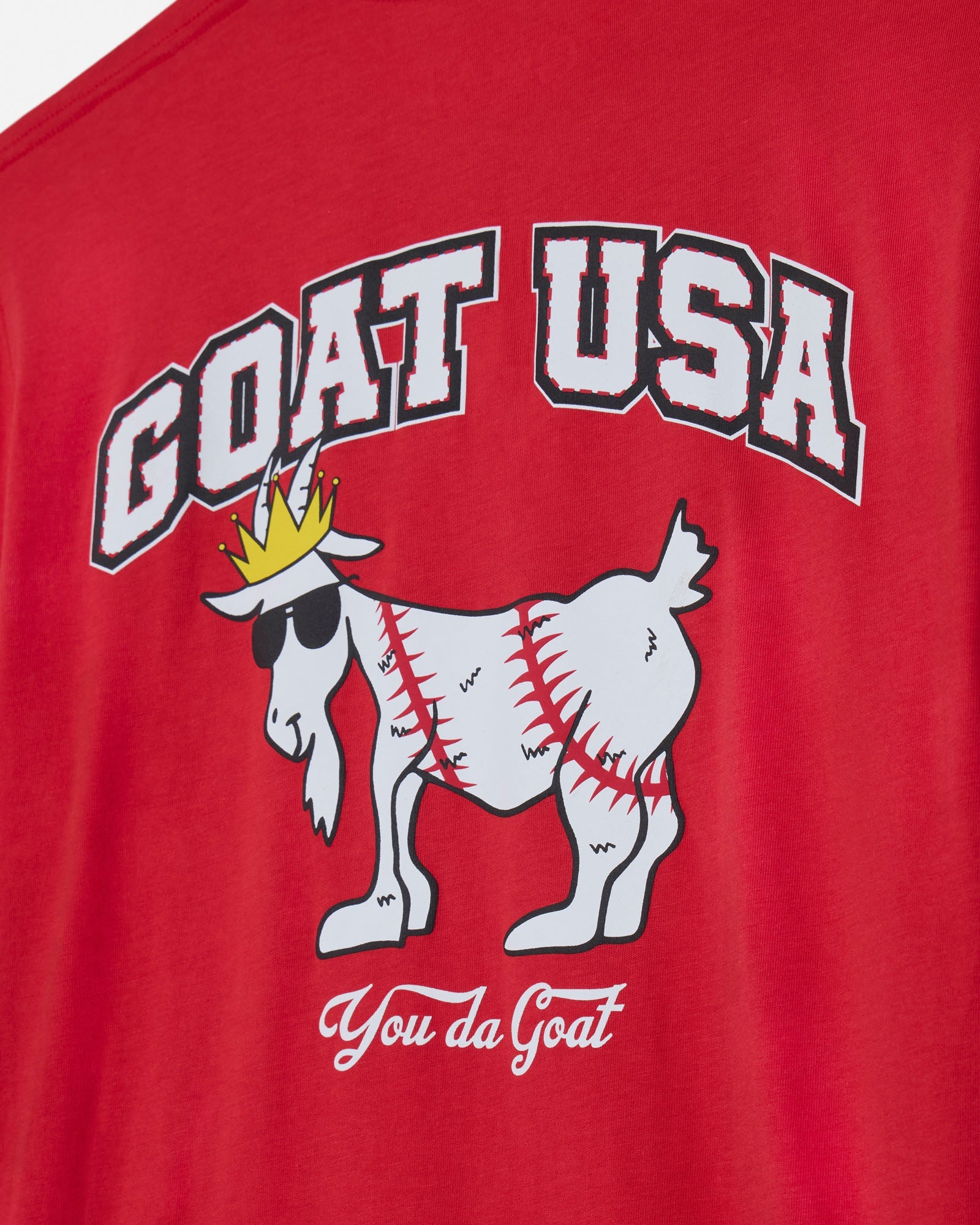 Red t-shirt with 'GOAT USA' and goat graphic design on a plain background