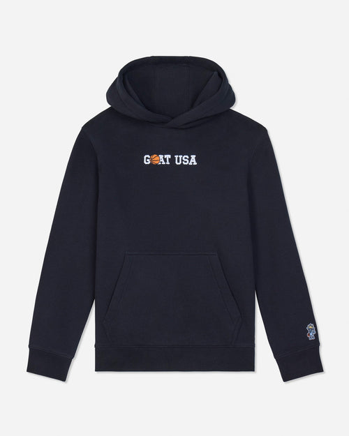 A black pullover hoodie with 'GOAT USA' printed across the chest in white and orange, and a small Goats Head logo on the left sleeve cuff, shown against a light gray background.