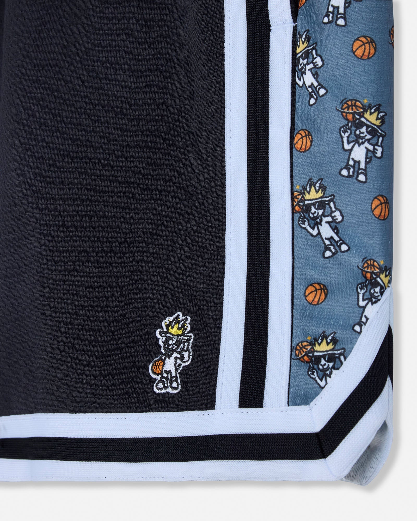Mesh shorts with cartoon character and ball design on a black and blue background