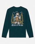 A dark teal long-sleeve t-shirt with a large graphic print on the front featuring a cartoon goat in a forest with the text 'GOAT USA BELIEVE IN THE GOAT'.