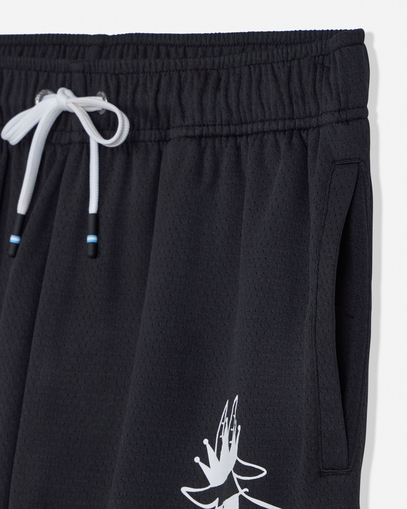 Black shorts with a white graphic design on a white background#color_black