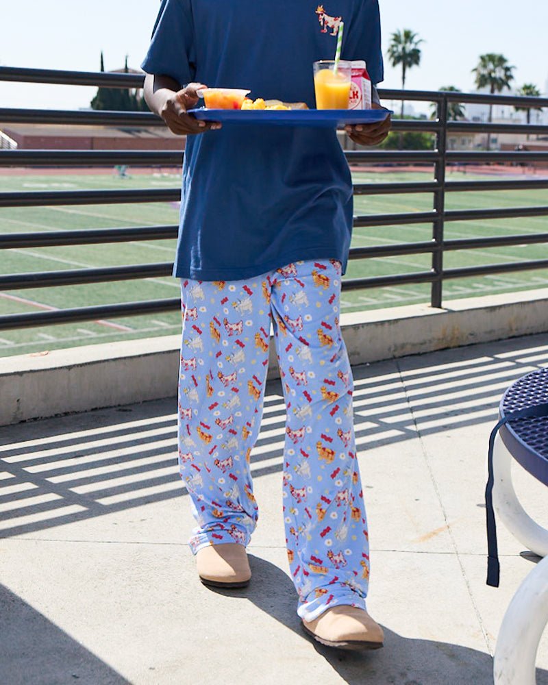 Front of carolina blue pajama pants on a male model with breakfast designs