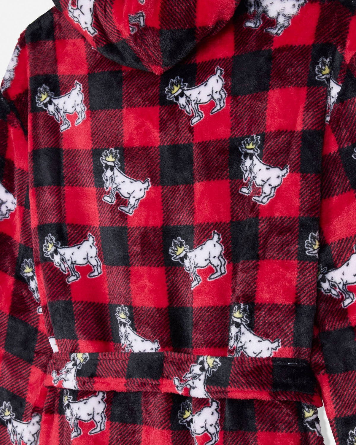 A close-up of a red and black buffalo plaid hooded robe with a repeating pattern of white goats wearing small gold crowns.