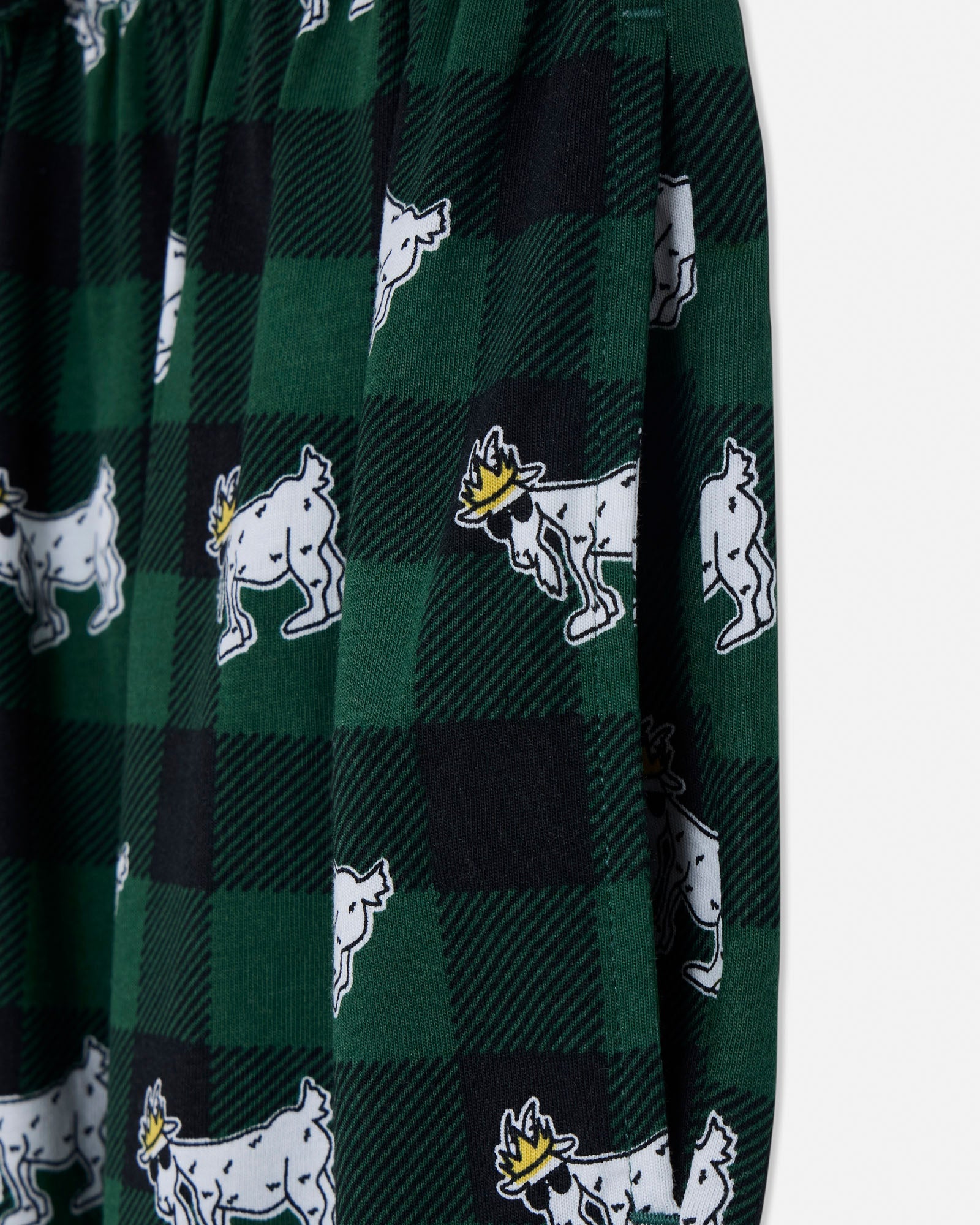 Green checkered fabric with white animal illustrations on a white background#color_deep-sea