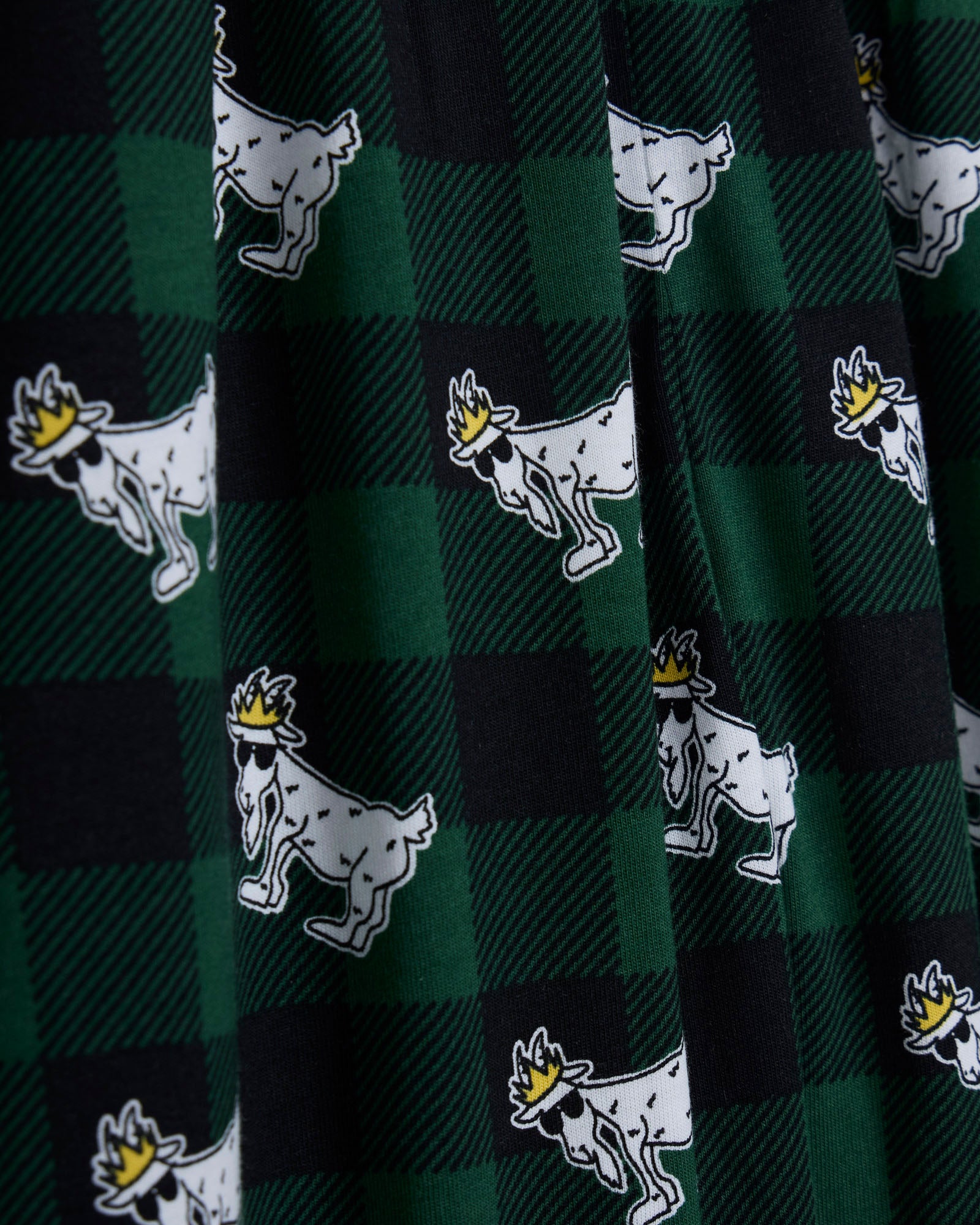 Green and black checkered fabric with white goat logo pattern#color_deep-sea