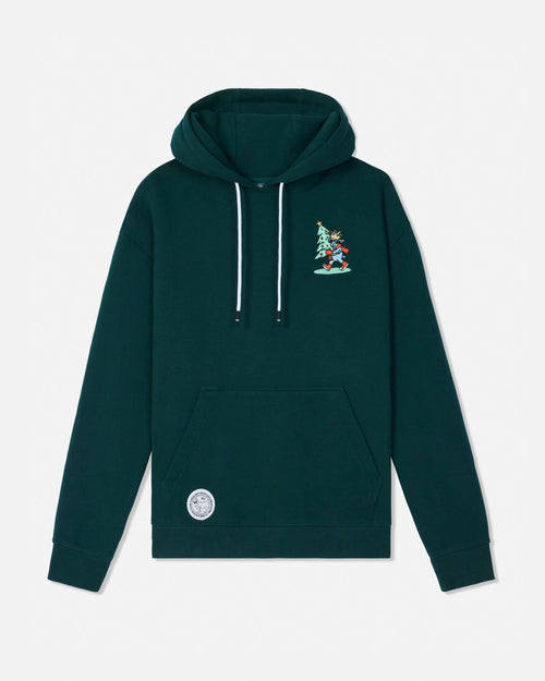 A dark green pullover hoodie with white drawstrings, a small embroidered graphic on the left chest, and a circular patch near the lower left front pocket, shown against a light gray background.