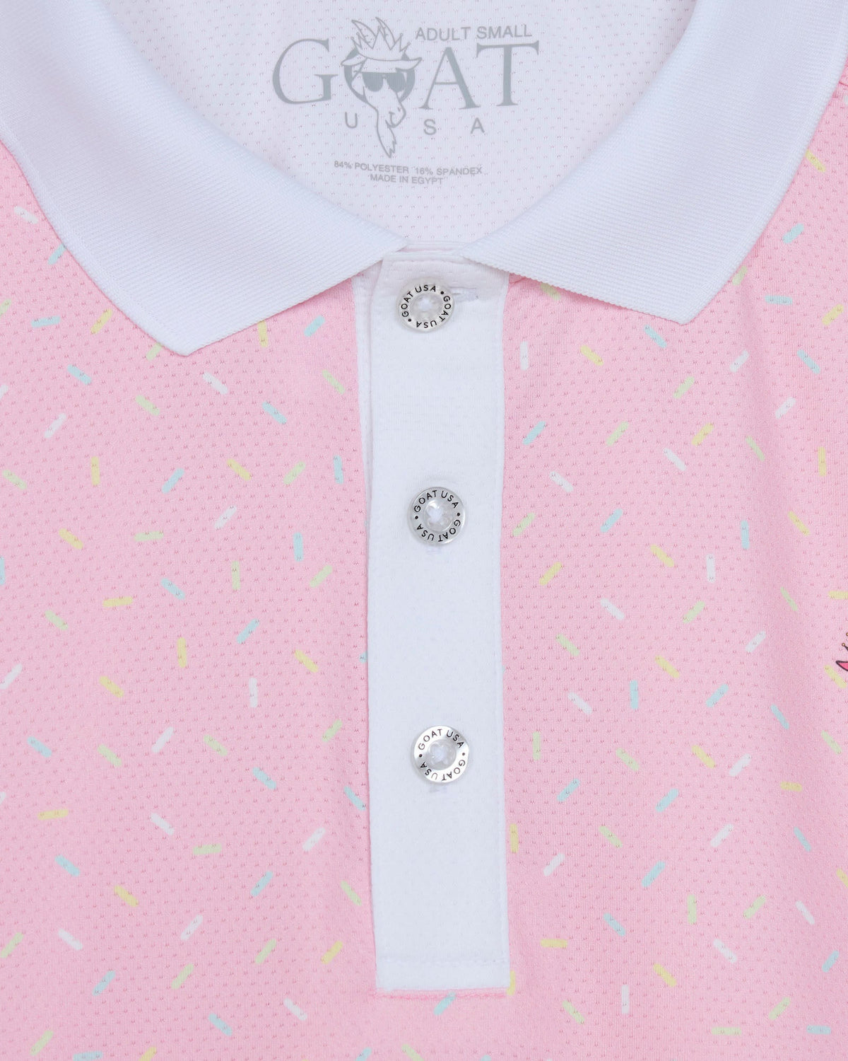 Pink polo shirt with white collar and decorative buttons, featuring the brand 'GOAT USA'.