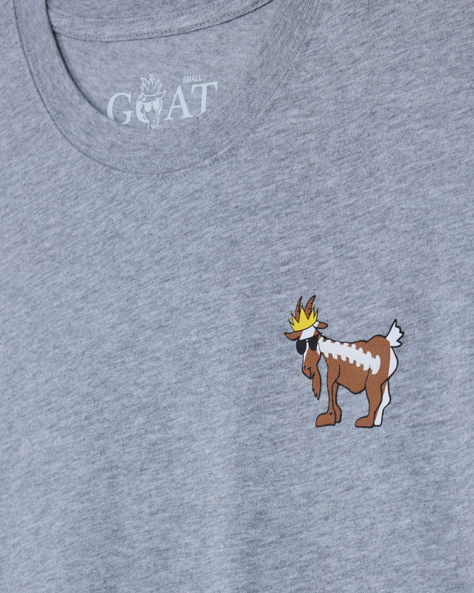 Gray t-shirt with a cartoon goat design and 'GOAT' text on a gray background