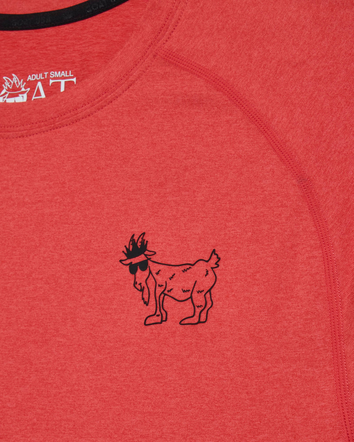 Red shirt with a black goat logo and 'GOAT' branding.