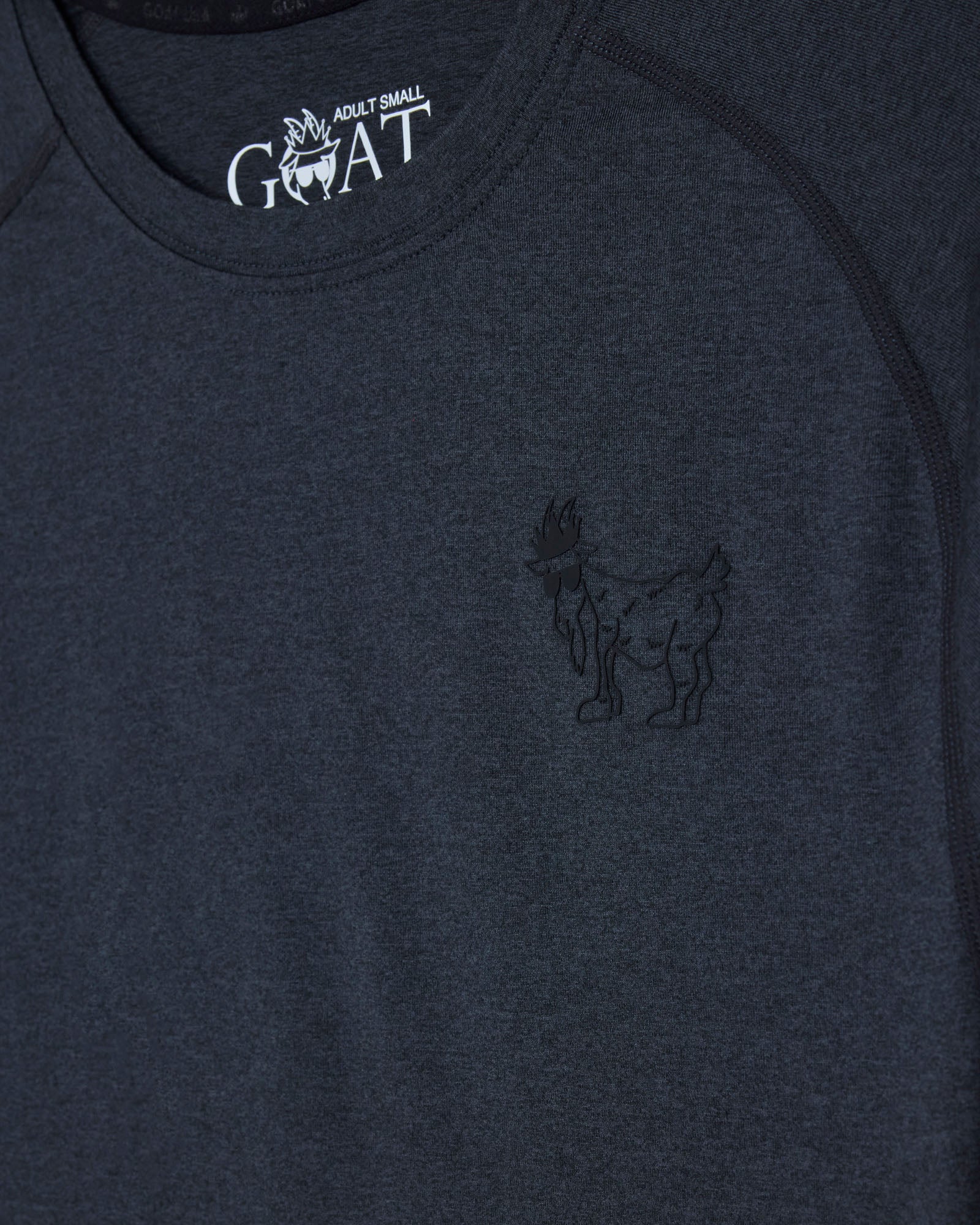 Black t-shirt with a logo on the chest and 'GOAT' branding above it#color_black