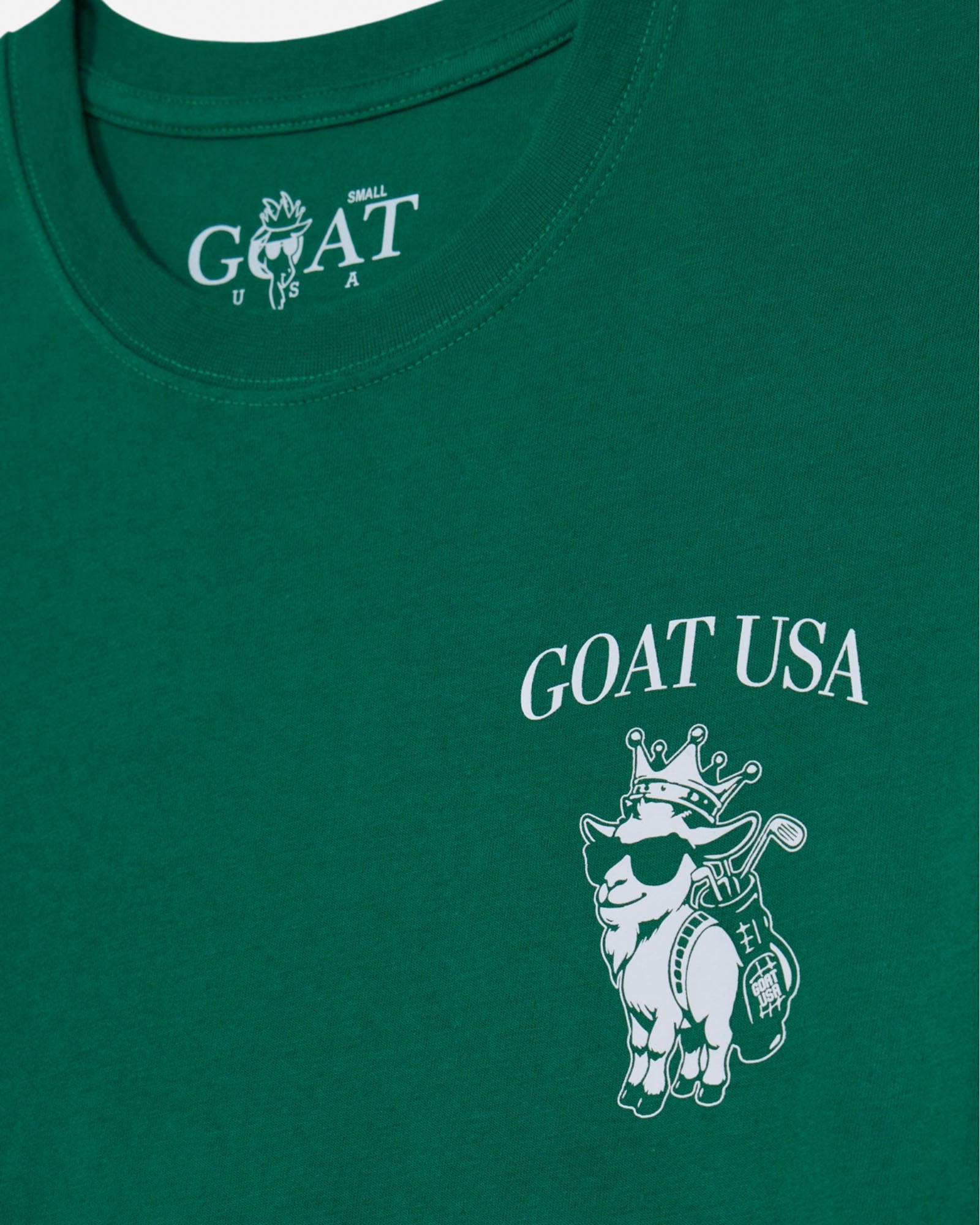 Green t-shirt with 'GOAT USA' logo and graphic on a white background