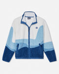 A fleece zip-up jacket with a wavy color-blocked pattern in white, light blue, and dark blue, featuring a stand collar, front zipper, and zippered hand pockets.