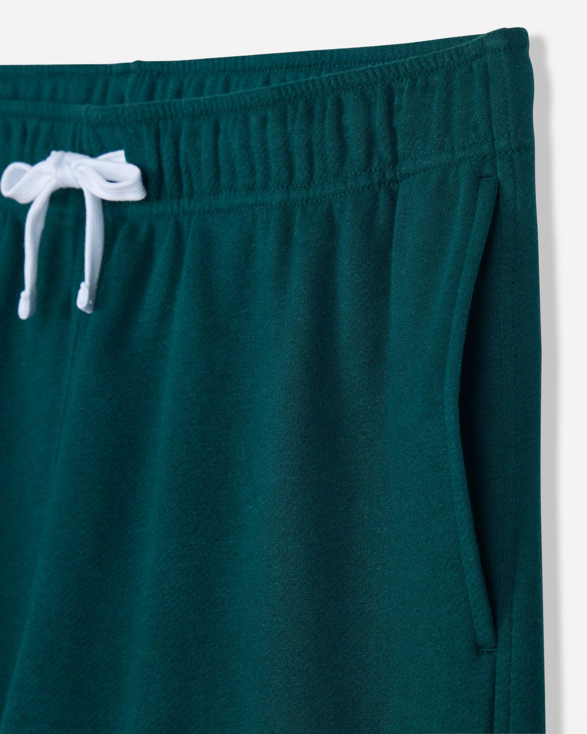 Close-up of pocket on sage french terry shorts