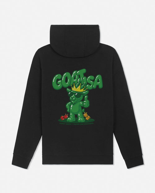 A black pullover hoodie shown from the back, featuring a large green graphic of a cartoon character wearing a gold crown and the word 'GOAT USA' in bold green letters above it.
