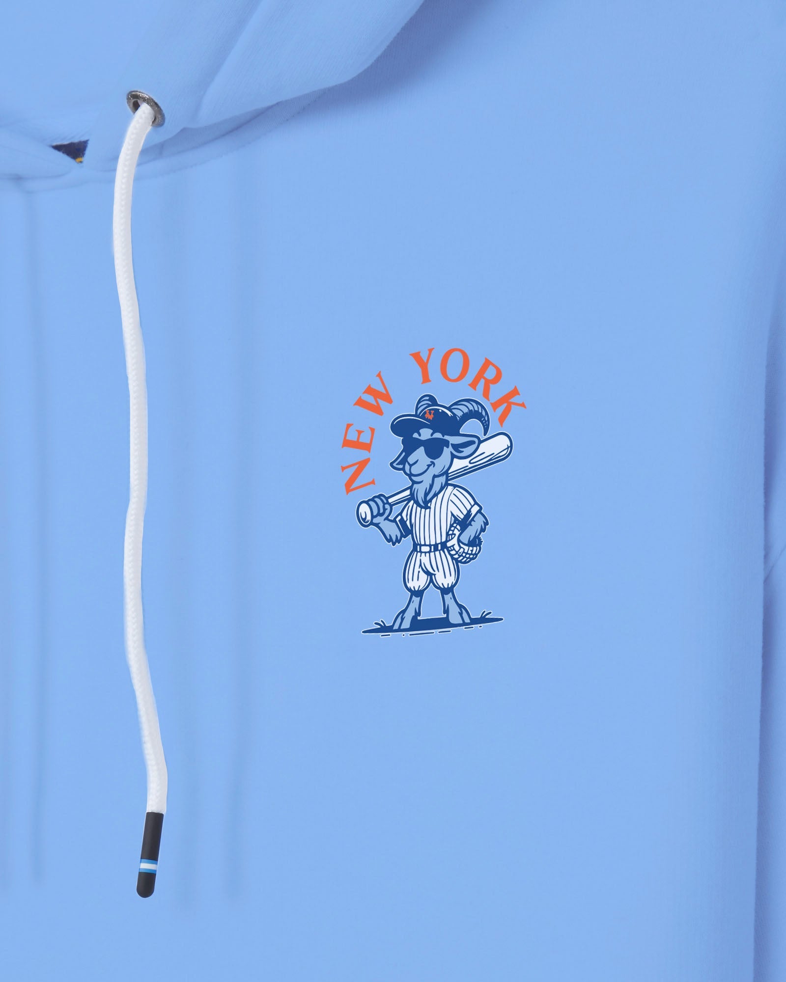 A close-up of a light blue hoodie featuring a white drawstring and a central graphic of a cartoon baseball player with the text 'NEW YORK' in orange.