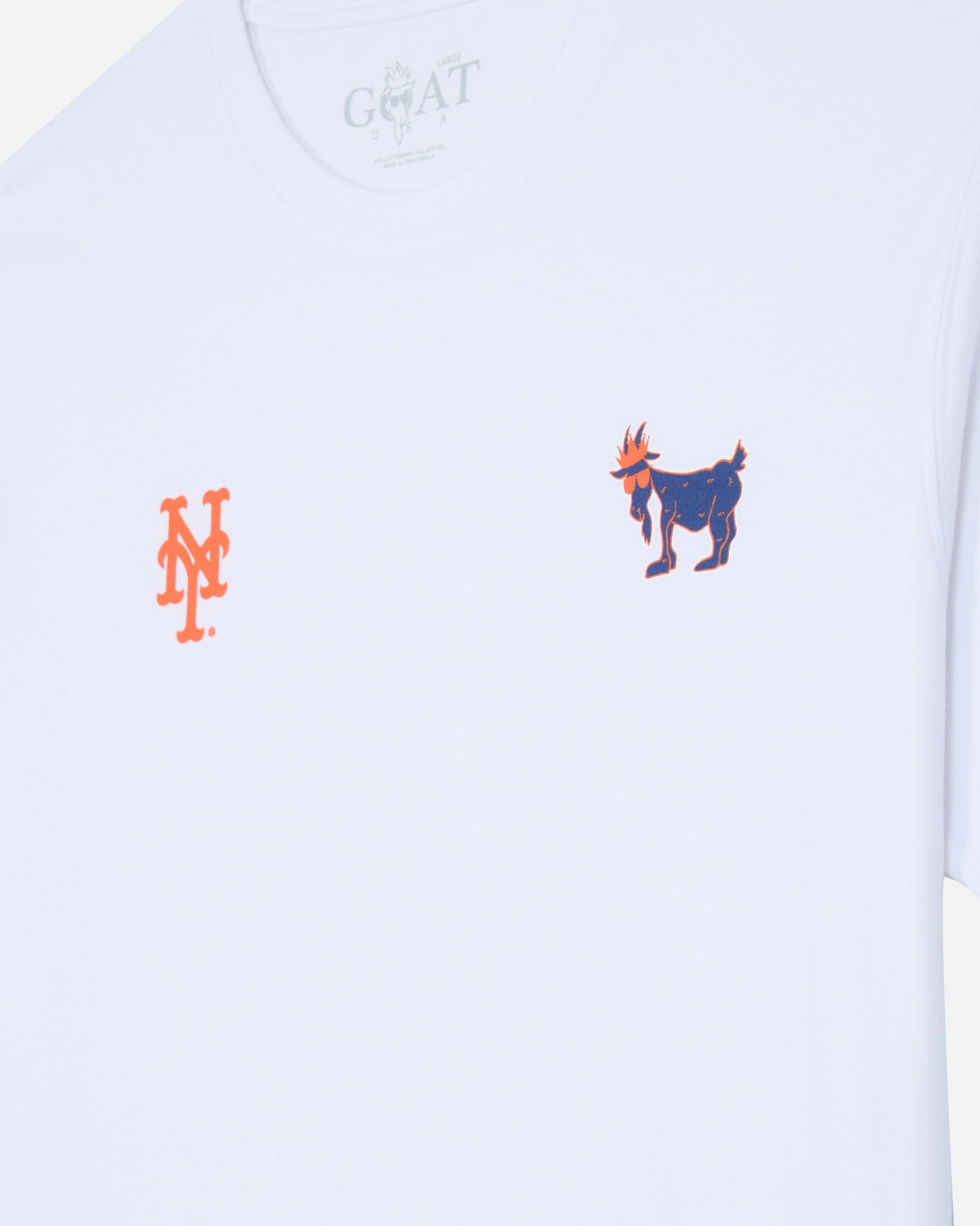 White short-sleeve t-shirt featuring an orange interlocking 'NY' logo on the left chest and a blue and orange goat graphic on the right chest, with a faint 'GOAT' print inside the collar.
