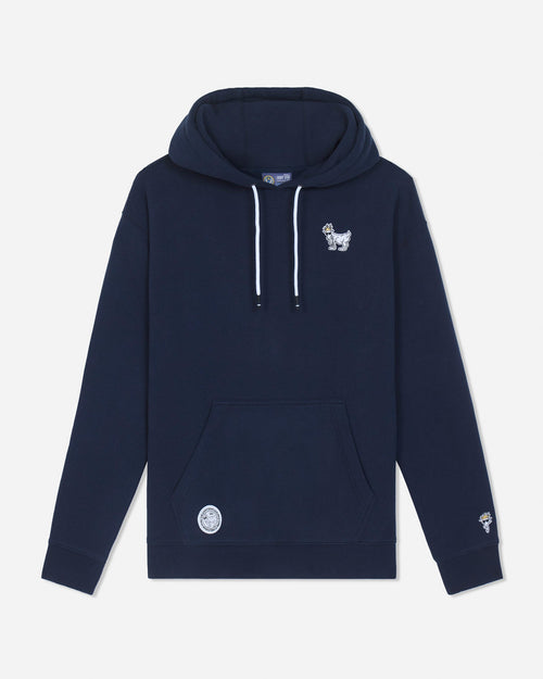 A navy blue pullover hoodie with white drawstrings, featuring a small white embroidered goat logo on the left chest and a circular white patch on the front pocket, displayed against a light gray background.