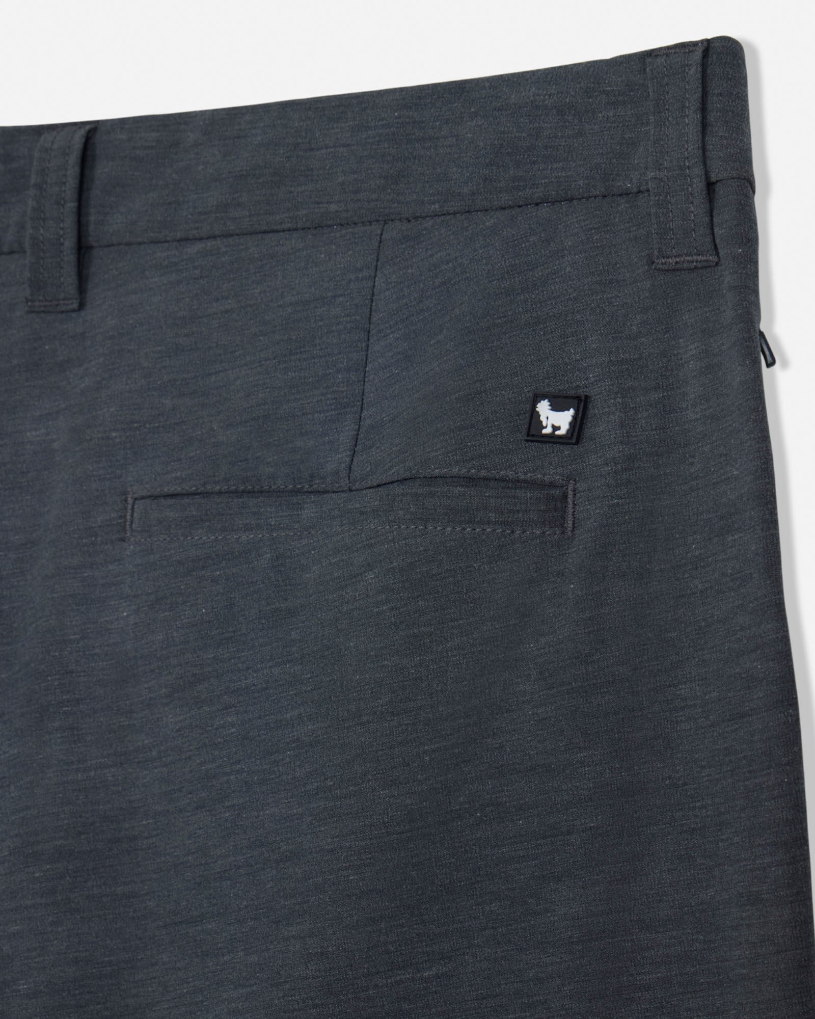 Dark gray pants with a small logo on the pocket against a white background#color_gray