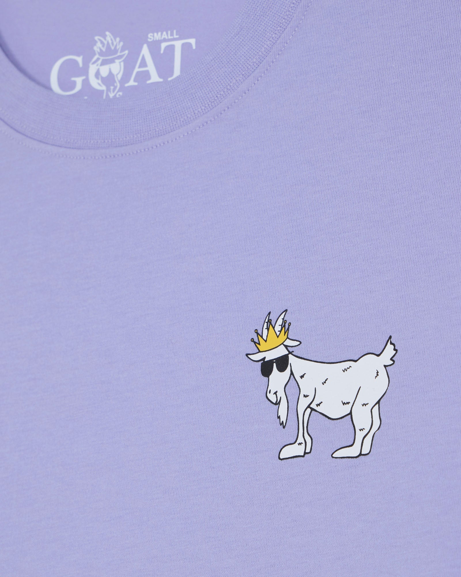 Purple t-shirt with a cartoon goat wearing a crown on a light purple background#color_periwinkle
