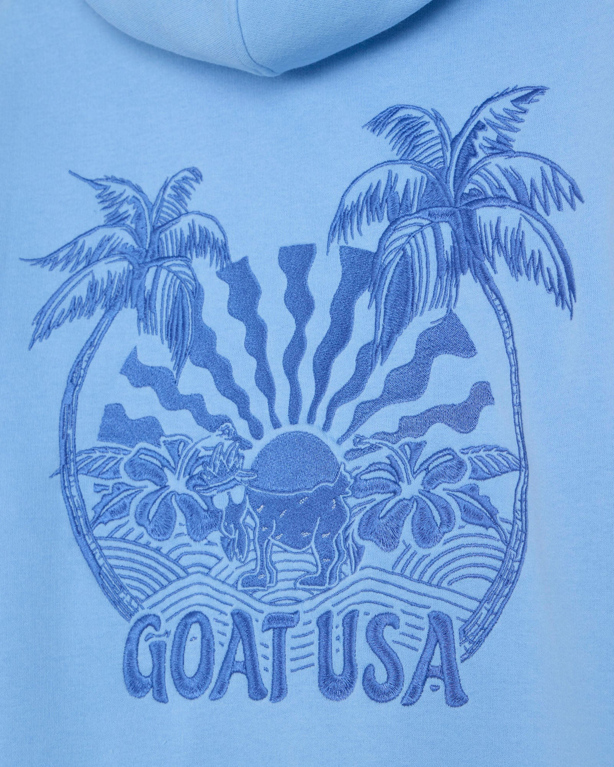 Blue hoodie with 'GOAT USA' graphic featuring palm trees and a sun.