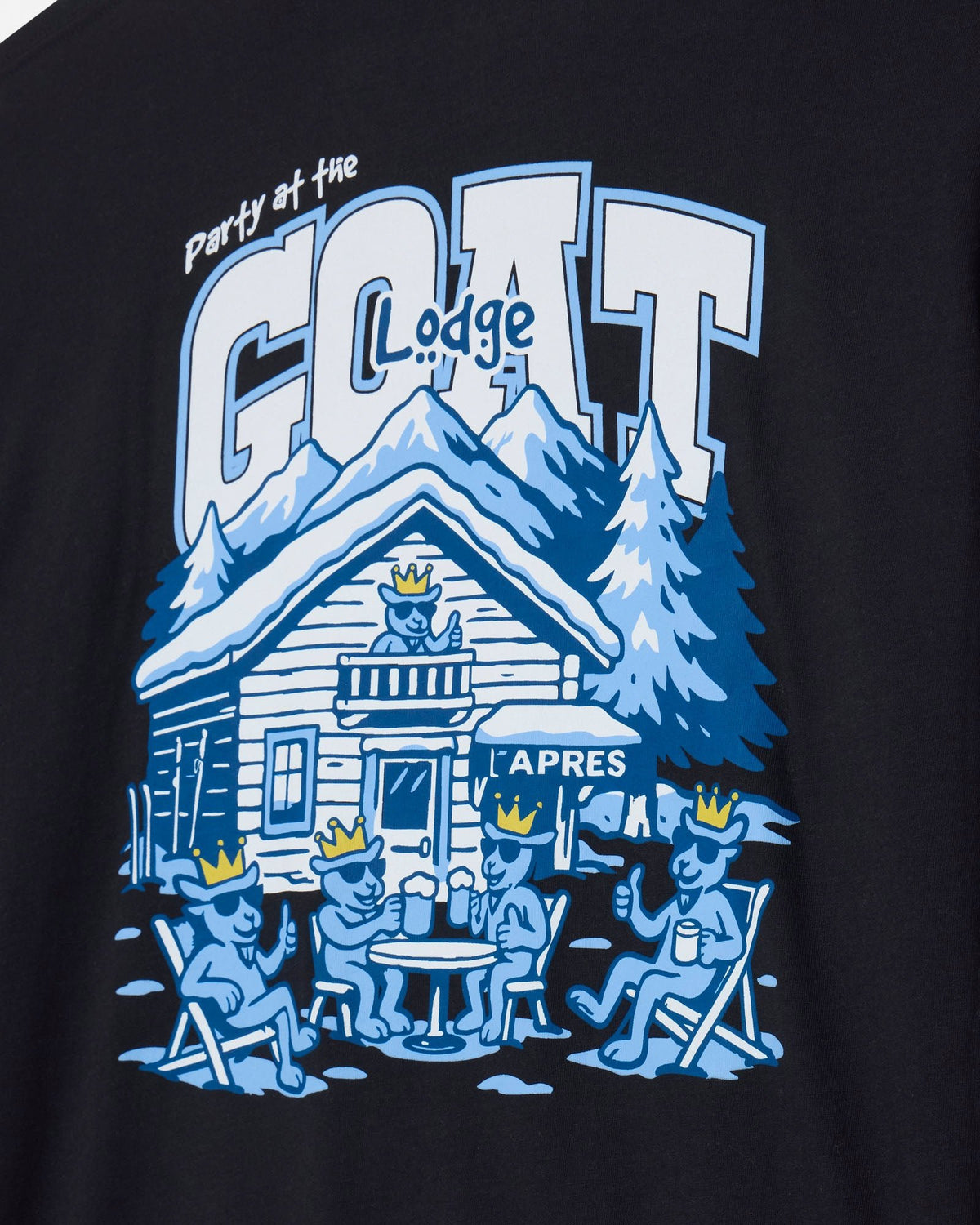 Close-up of a black graphic t-shirt featuring a blue and white illustration of a mountain lodge with the text 'Party at the GOAT Lodge' and 'APRES'.