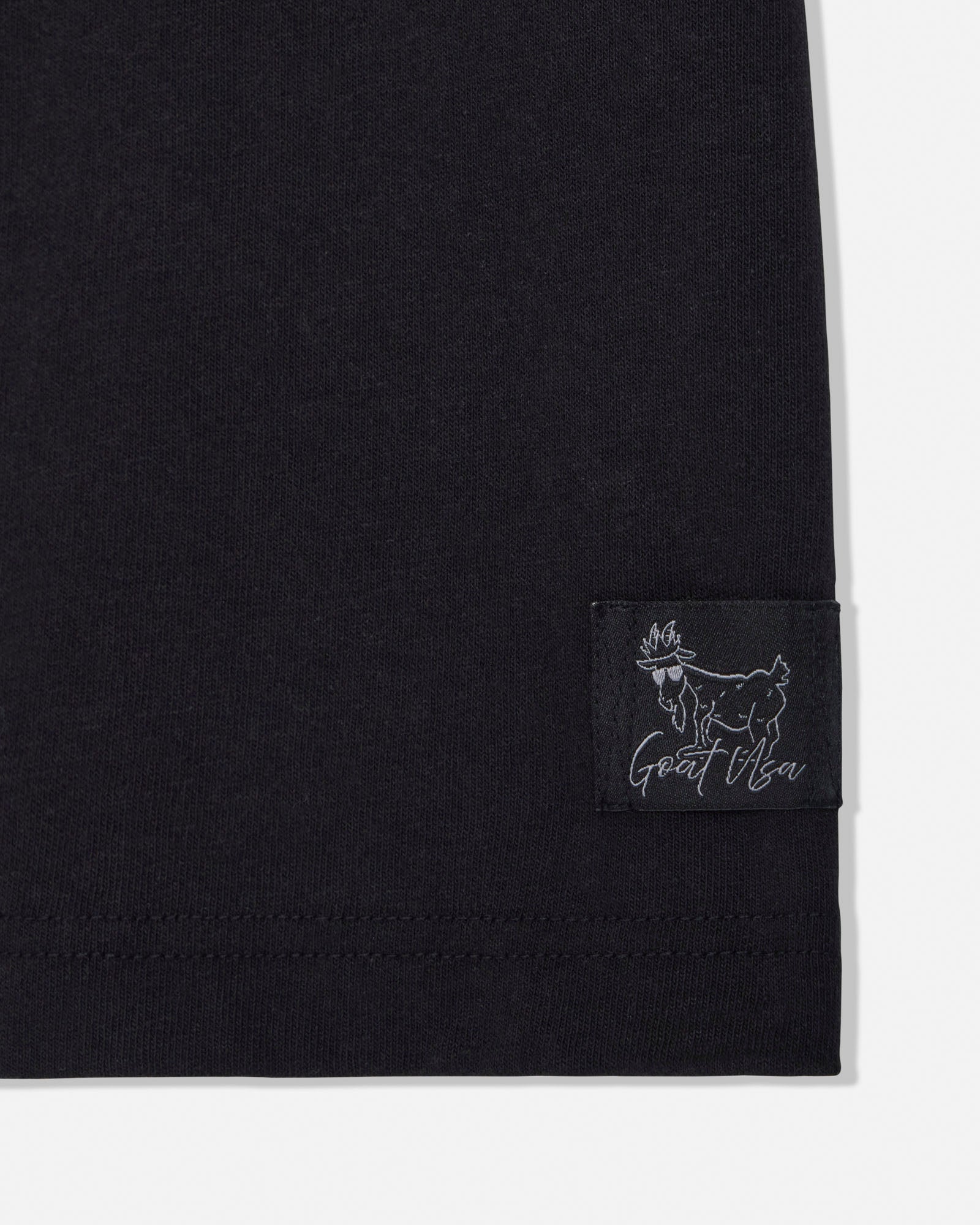 Black t-shirt with a small stitched tag#color_black