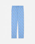 Blue pajama pants with animal pattern on a light gray background