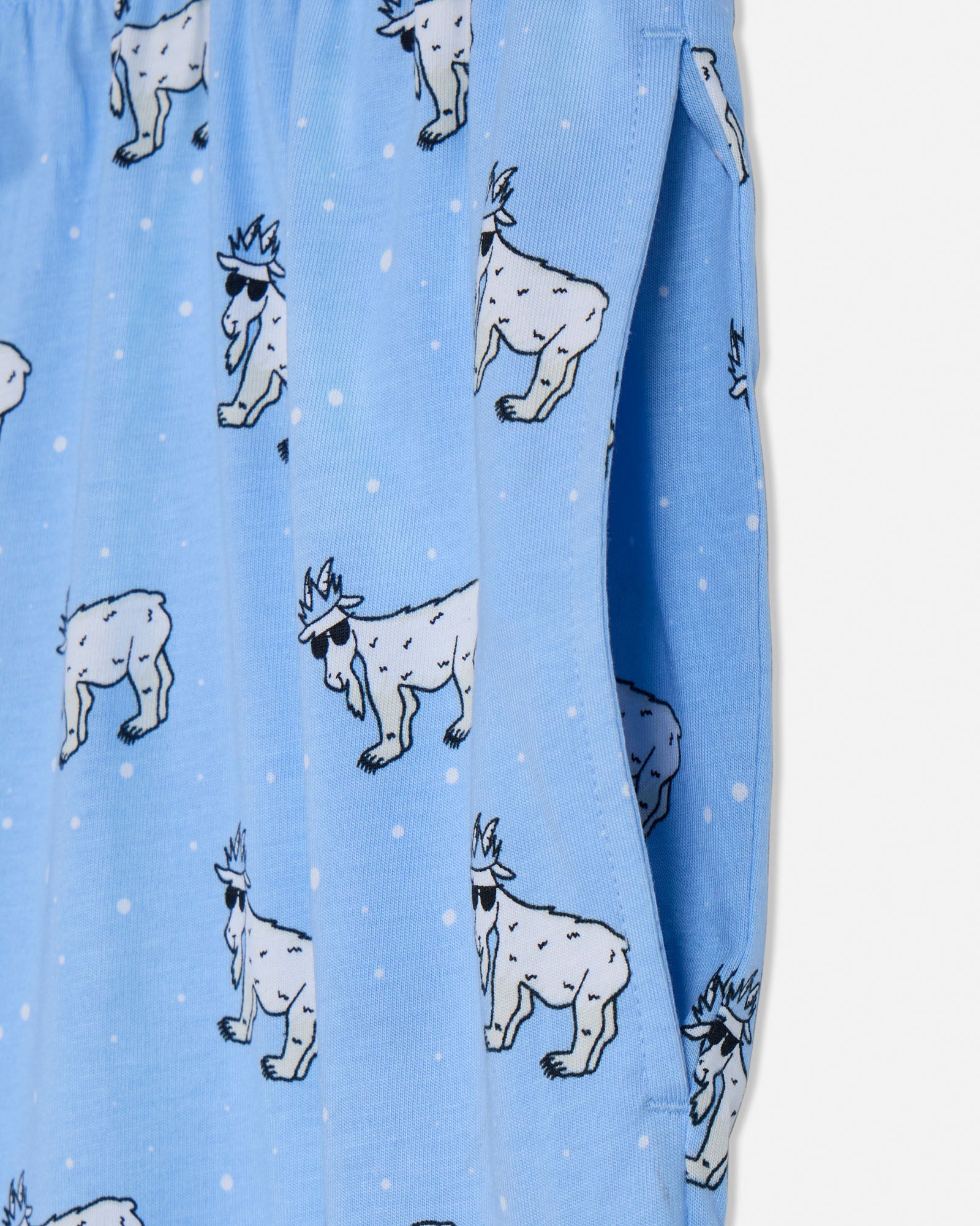 Blue fabric with white cartoon-like animal designs on a light blue background