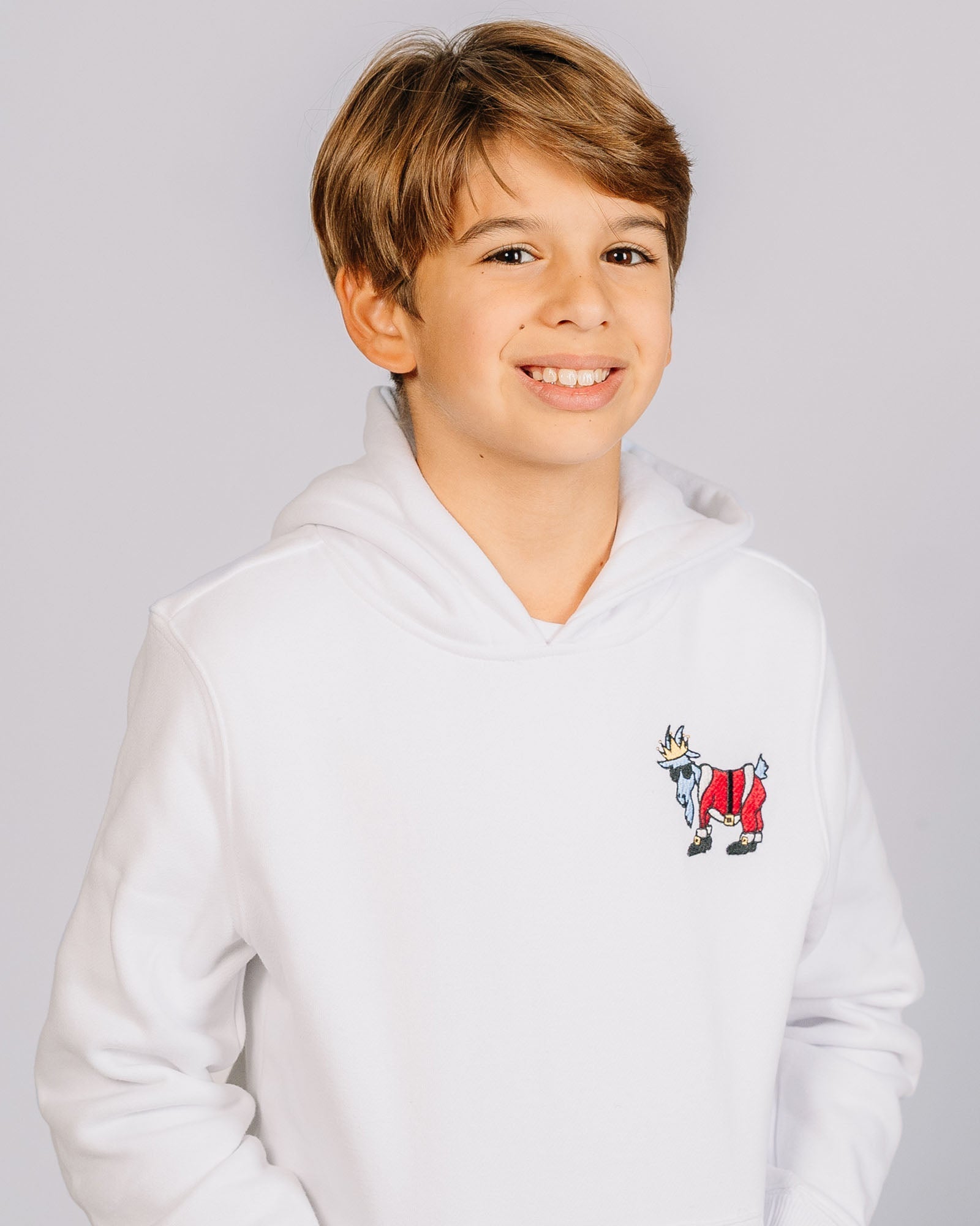 Kid wearing Santa goat hoodie
