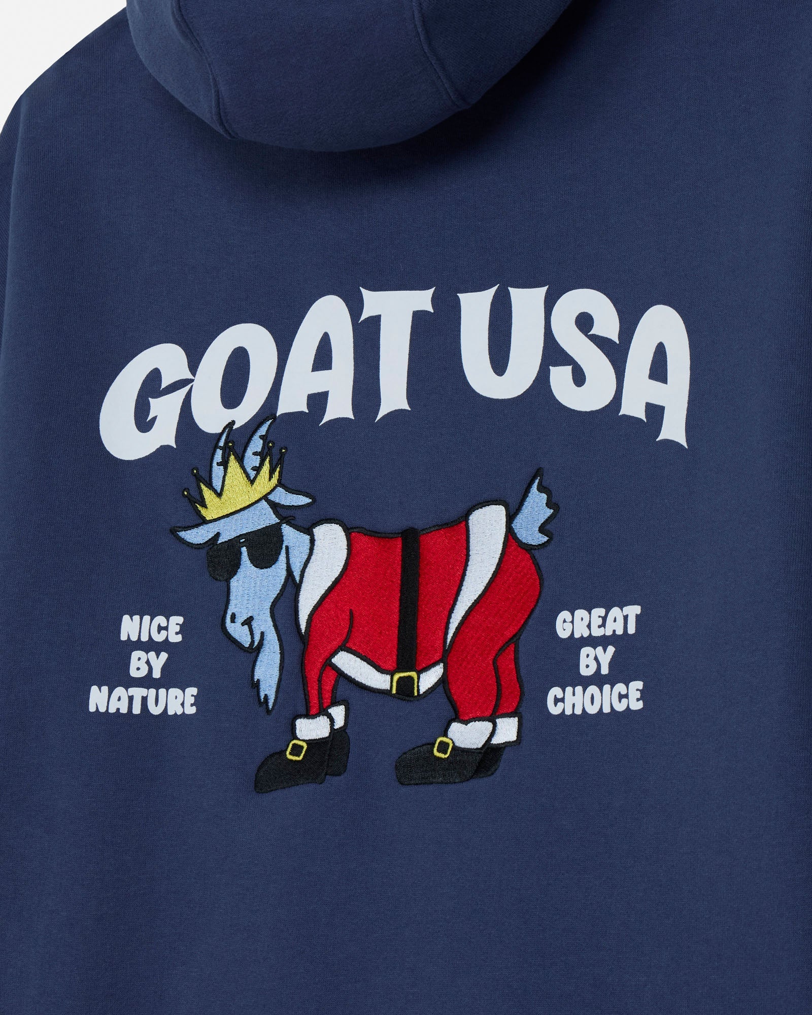 Navy blue hoodie with 'GOAT USA' graphic featuring a goat in a Santa outfit.