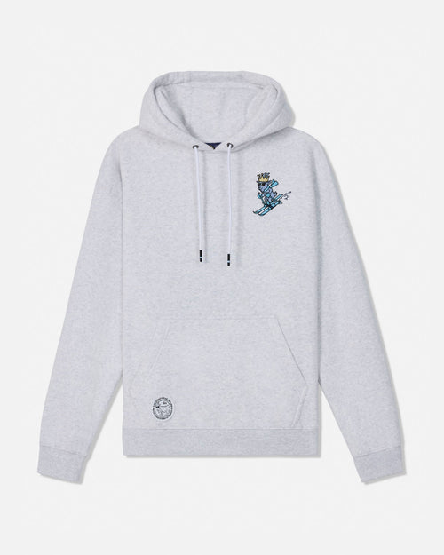 A light gray heather pullover hoodie with a small blue and gold graphic of a crowned skier on the left chest and a circular logo patch near the lower left front pocket, displayed on a clean white background.