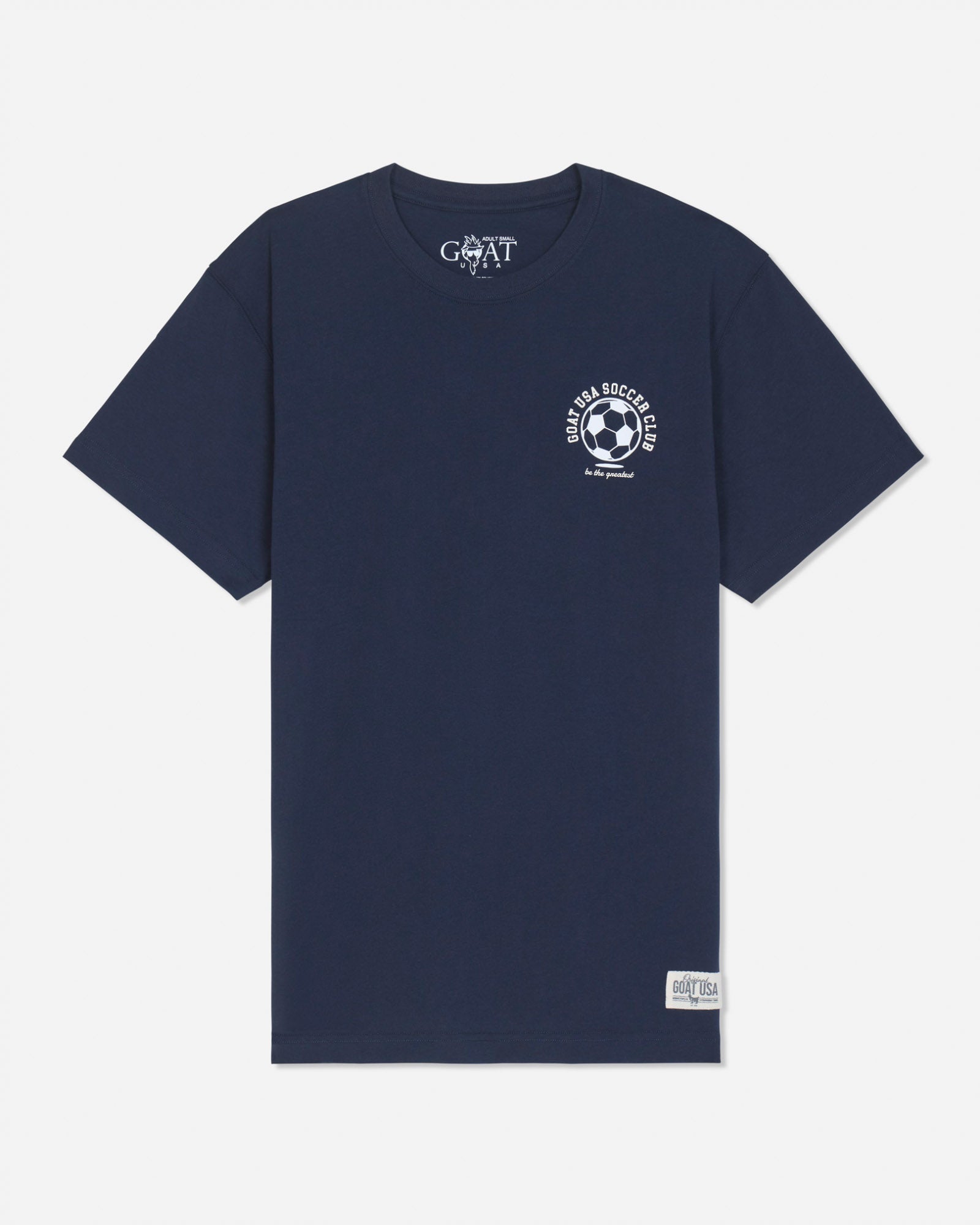 A navy blue short-sleeve t-shirt with a white circular soccer-themed graphic on the left chest and a white 'GOAT' brand print inside the collar, displayed on a light gray background.