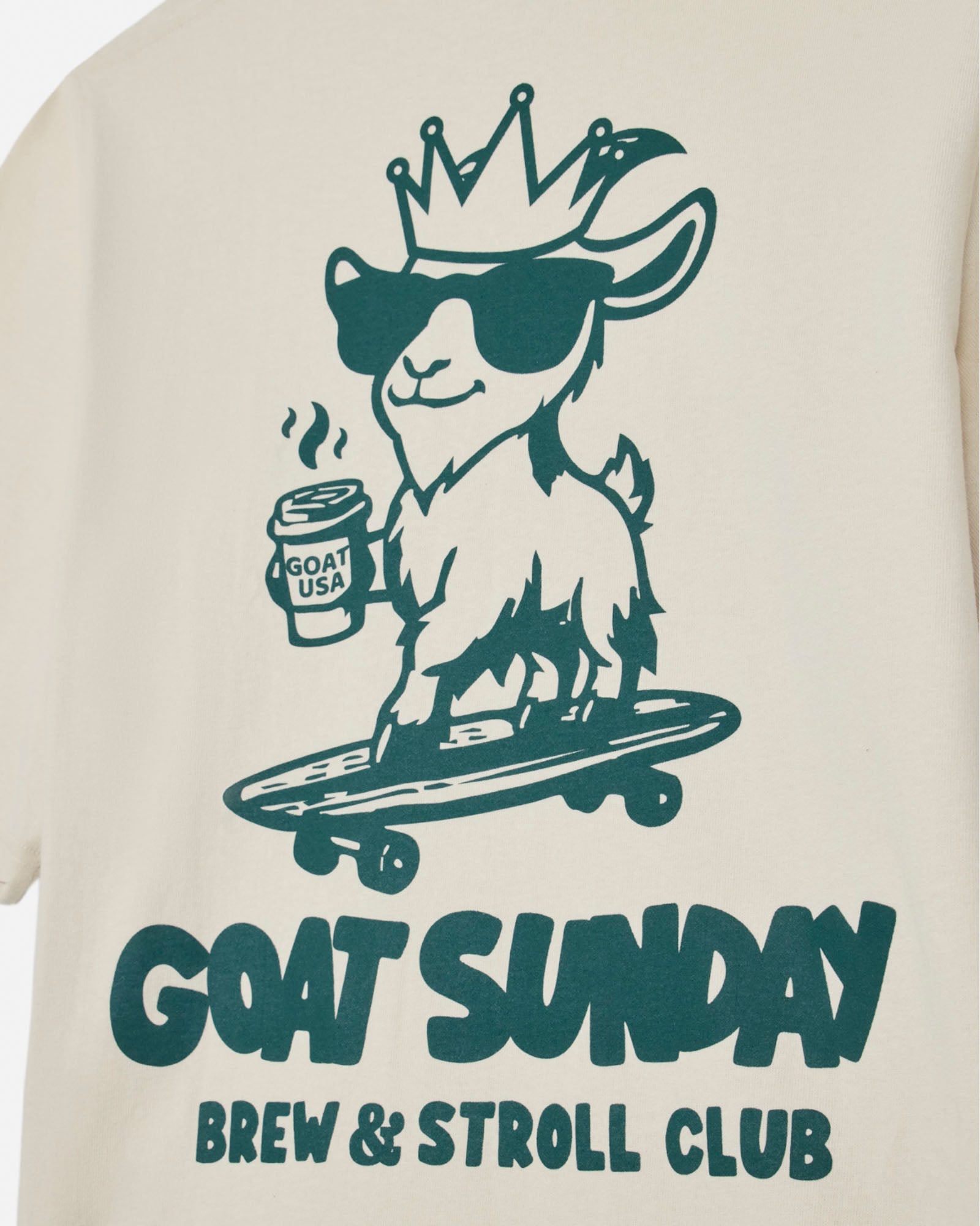 T-shirt with a graphic of a goat on a skateboard holding a coffee cup, with 'GOAT SUNDAY Brew & Stroll Club' text.